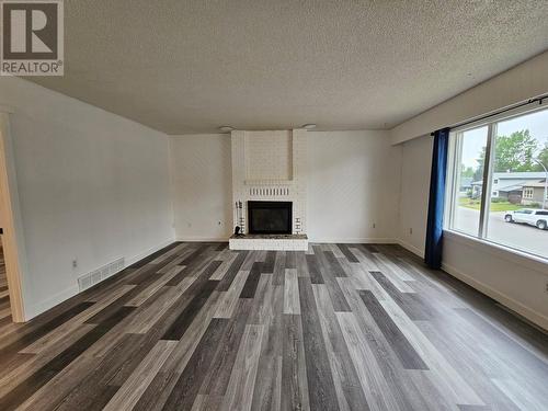 219 Cottonwood Crescent, Tumbler Ridge, BC - Indoor Photo Showing Living Room With Fireplace