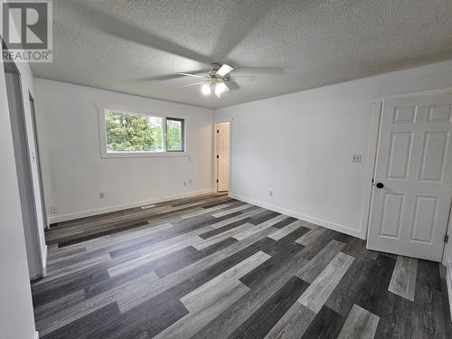 219 Cottonwood Crescent, Tumbler Ridge, BC - Indoor Photo Showing Living Room With Fireplace