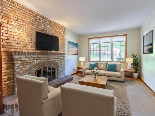 Salle familiale - 8455 Av. San-Francisco, Brossard, QC - Indoor Photo Showing Living Room With Fireplace