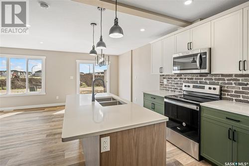 2973 Green Stone Road, Regina, SK - Indoor Photo Showing Kitchen With Double Sink With Upgraded Kitchen