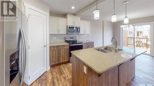 2973 Green Stone Road, Regina, SK - Indoor Photo Showing Kitchen With Double Sink With Upgraded Kitchen