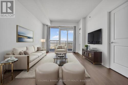 1612 - 65 Speers Road, Oakville, ON - Indoor Photo Showing Living Room