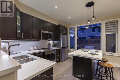 77 - 1812 Burnhamthorpe Road E, Mississauga, ON - Indoor Photo Showing Kitchen With Stainless Steel Kitchen With Double Sink With Upgraded Kitchen