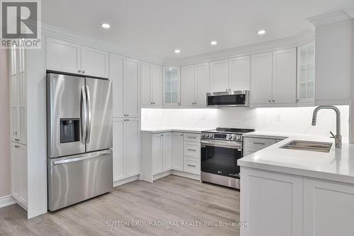 104 - 90 Fisherville Road, Toronto, ON - Indoor Photo Showing Kitchen With Double Sink With Upgraded Kitchen