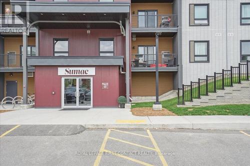 213 - 4 Spice Way, Barrie, ON - Outdoor With Balcony With Facade