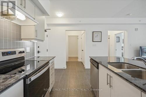 213 - 4 Spice Way, Barrie, ON - Indoor Photo Showing Kitchen With Double Sink