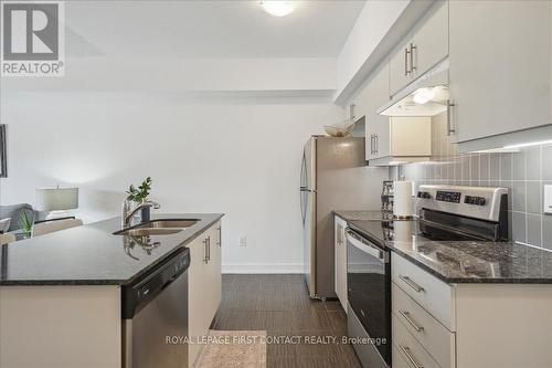 213 - 4 Spice Way, Barrie, ON - Indoor Photo Showing Kitchen With Stainless Steel Kitchen With Double Sink With Upgraded Kitchen