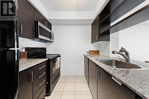 603 - 30 Herons Hill Way, Toronto, ON - Indoor Photo Showing Kitchen