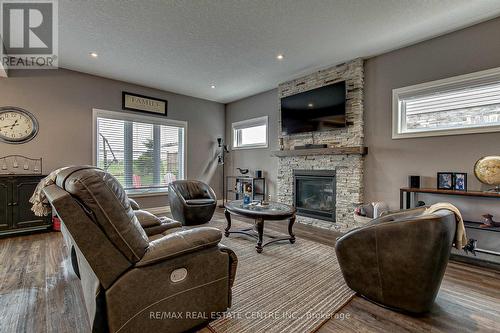 587 Hawthorne Place, Woodstock, ON - Indoor Photo Showing Living Room With Fireplace