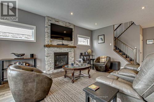 587 Hawthorne Place, Woodstock, ON - Indoor Photo Showing Living Room With Fireplace