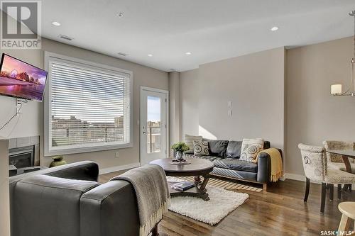 707 2055 Rose Street, Regina, SK - Indoor Photo Showing Living Room With Fireplace