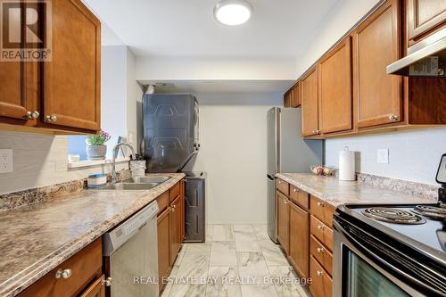 612 - 3077 Weston Road N, Toronto, ON - Indoor Photo Showing Kitchen With Double Sink