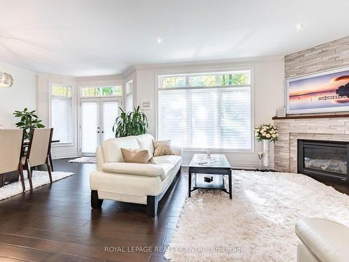 37 Heron Blvd, Springwater, ON - Indoor Photo Showing Living Room With Fireplace