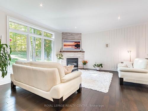 37 Heron Blvd, Springwater, ON - Indoor Photo Showing Living Room With Fireplace