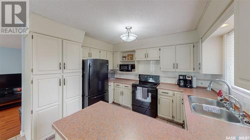 35 Meadow Road, White City, SK - Indoor Photo Showing Kitchen With Double Sink