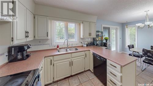 35 Meadow Road, White City, SK - Indoor Photo Showing Kitchen With Double Sink