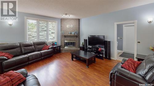 35 Meadow Road, White City, SK - Indoor Photo Showing Living Room With Fireplace