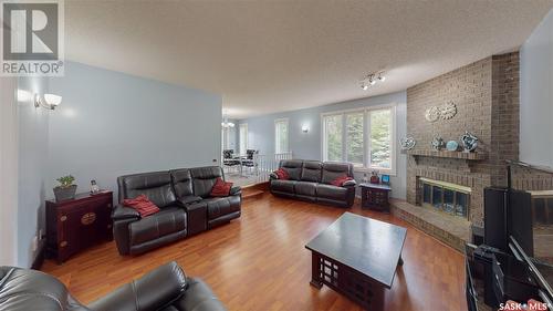 35 Meadow Road, White City, SK - Indoor Photo Showing Living Room With Fireplace