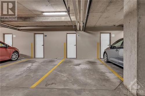 Parking + Additional locker. - 151 Potts Private Unit#311, Ottawa, ON - Indoor Photo Showing Garage