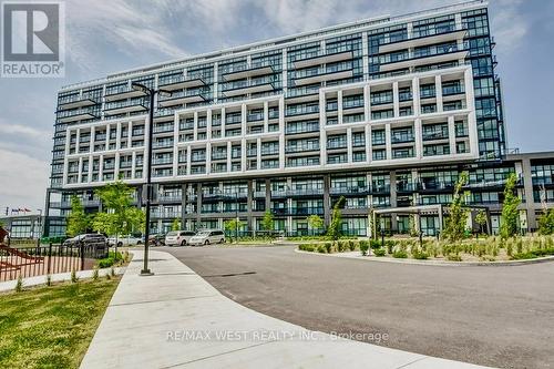 409 - 50 George Butchart Drive, Toronto, ON - Outdoor With Facade