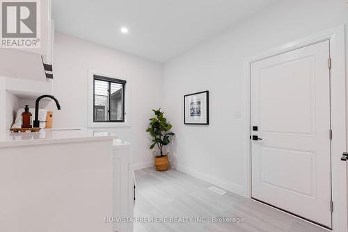 Main Floor Laundry Room with Quartz Counters - 1570 Benjamin Drive, London, ON - Indoor Photo Showing Other Room