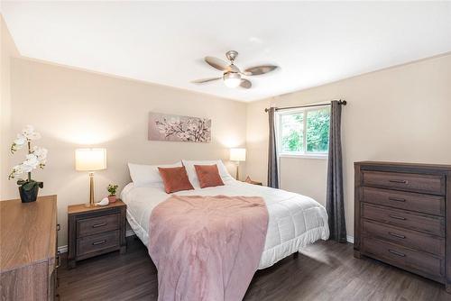 Primary bedroom with ceiling fan, view of backyard. - 47 Simson Avenue, Simcoe, ON - Indoor Photo Showing Bedroom