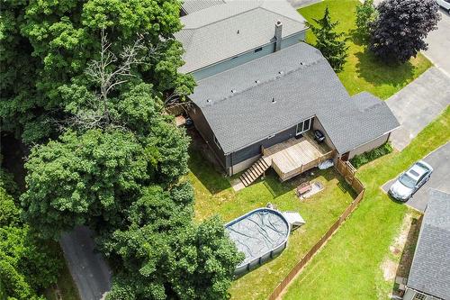 Fenced private backyard with oversized deck, 12' x 28' on ground pool and 10' x 10' Yard Barn. - 47 Simson Avenue, Simcoe, ON - Outdoor With Deck Patio Veranda