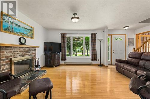 3483 Route 134, Shediac Cape, NB - Indoor Photo Showing Living Room With Fireplace