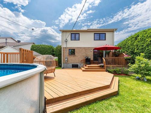 Cour - 7062 Rue Des Bégonias, Longueuil (Saint-Hubert), QC - Outdoor With Above Ground Pool With Deck Patio Veranda With Exterior