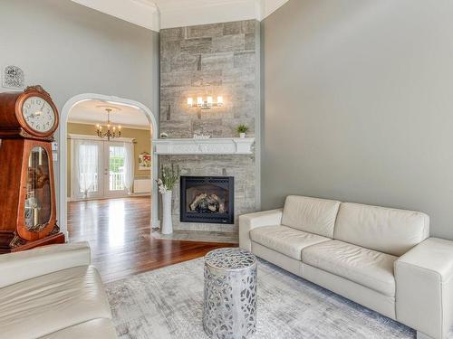 Living room - 107 Rue St-Pierre E., Saint-Sauveur, QC - Indoor Photo Showing Living Room With Fireplace