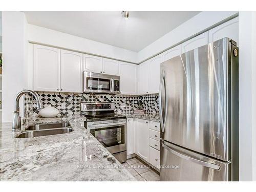 913-11 Michael Power Pl, Toronto, ON - Indoor Photo Showing Kitchen With Stainless Steel Kitchen With Double Sink With Upgraded Kitchen