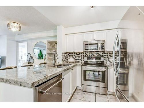 913-11 Michael Power Pl, Toronto, ON - Indoor Photo Showing Kitchen With Stainless Steel Kitchen With Double Sink With Upgraded Kitchen