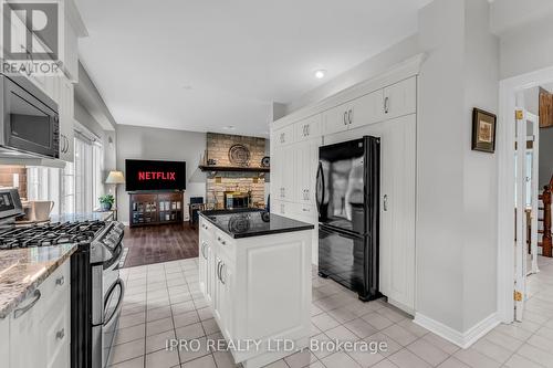 8 - 25 Manor Park Crescent, Guelph, ON - Indoor Photo Showing Kitchen With Fireplace