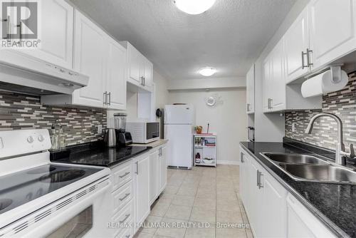 405 - 121 Trudelle Street, Toronto, ON - Indoor Photo Showing Kitchen With Double Sink