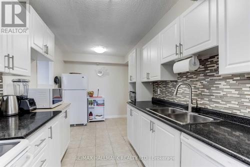 405 - 121 Trudelle Street, Toronto, ON - Indoor Photo Showing Kitchen With Double Sink