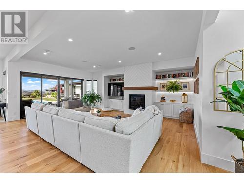 5711 Jasper Way, Kelowna, BC - Indoor Photo Showing Living Room With Fireplace