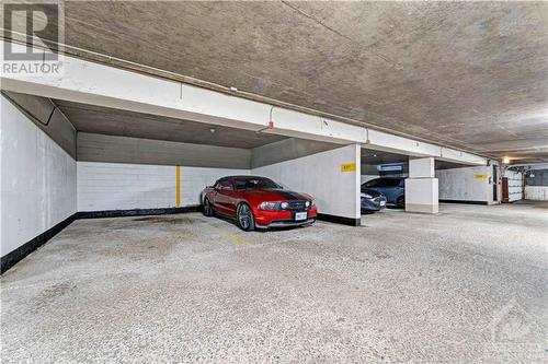 2000 Jasmine Crescent Unit#718, Ottawa, ON - Indoor Photo Showing Garage