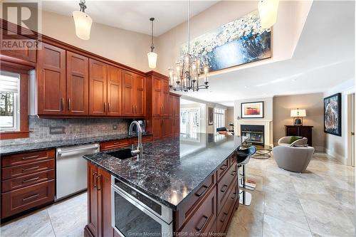 373 Lavoie, Dieppe, NB - Indoor Photo Showing Kitchen With Fireplace