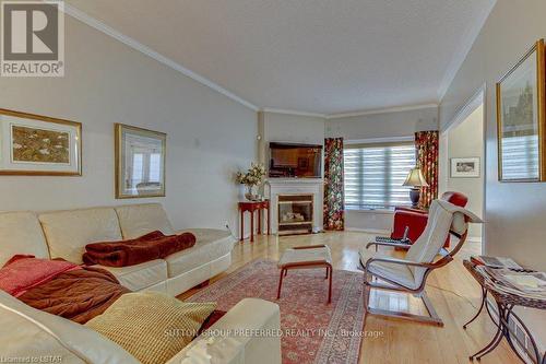 8 - 681 Commissioners Road W, London, ON - Indoor Photo Showing Living Room With Fireplace