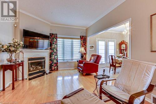 8 - 681 Commissioners Road W, London, ON - Indoor Photo Showing Living Room With Fireplace