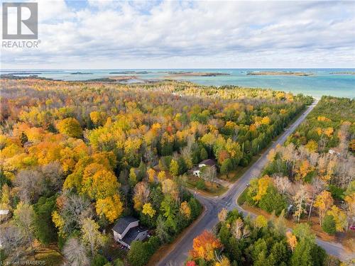 Shot of the crossroad down to the beach - 34 Rolling Hills Drive, Oliphant, ON 