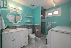 Main floor - 3-piece bath and laundry shared space - 