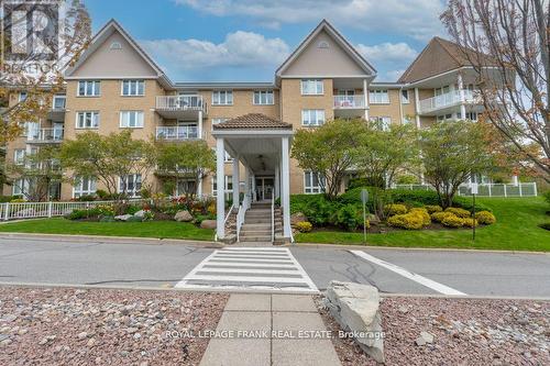 209 - 51 Rivermill Boulevard, Kawartha Lakes, ON - Outdoor With Balcony With Facade