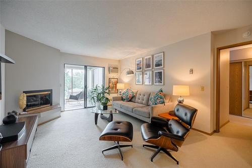 202 693 St Anne'S Road, Winnipeg, MB - Indoor Photo Showing Living Room With Fireplace