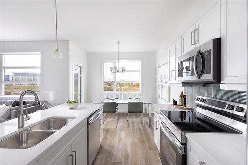 155 Grey Heron Drive, Winnipeg, MB - Indoor Photo Showing Kitchen With Stainless Steel Kitchen With Double Sink With Upgraded Kitchen