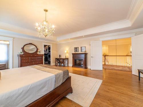 Chambre Ã  coucher principale - 3625 Rue De Lisbonne, Brossard, QC - Indoor Photo Showing Bedroom With Fireplace