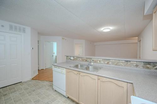 1450 Bishops Gate|Unit #101, Oakville, ON - Indoor Photo Showing Kitchen With Double Sink