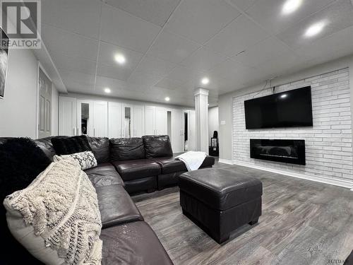 201 Crawford St, Timmins, ON - Indoor Photo Showing Living Room With Fireplace