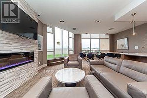 607 - 1276 Maple Crossing Boulevard, Burlington, ON - Indoor Photo Showing Living Room With Fireplace