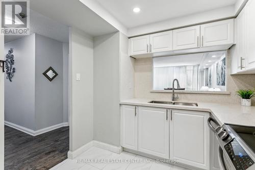 308 - 24 Hanover Road, Brampton, ON - Indoor Photo Showing Kitchen With Double Sink